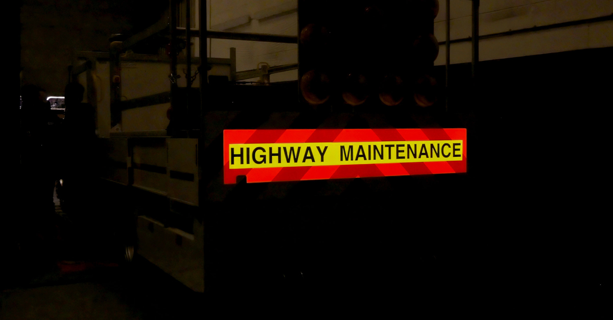 Blinc-Open-Day-fitting-for-Flatbed-lorry-chevrons-lit Pic showing the Blinc illuminated safety graphics lit up on the back of a flatbed lorry