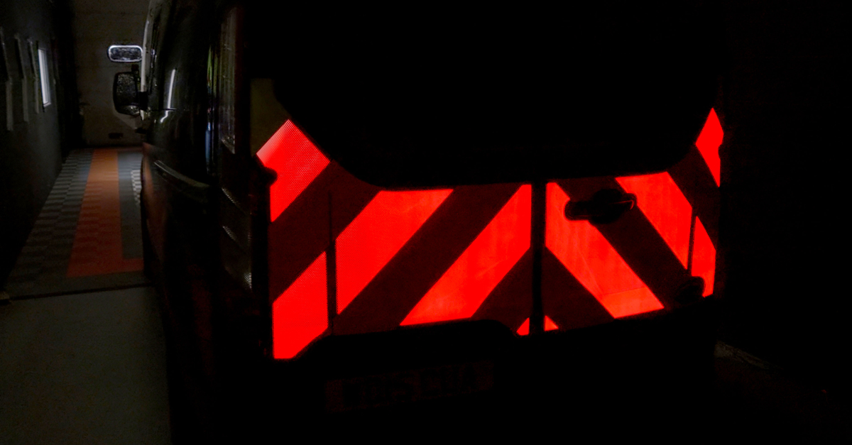 Blinc-Open-Day-fitting-for-Transit-Van-chevrons-lit Pic showing Blinc Light illuminated safety chevrons on the back of a Transit lit in red